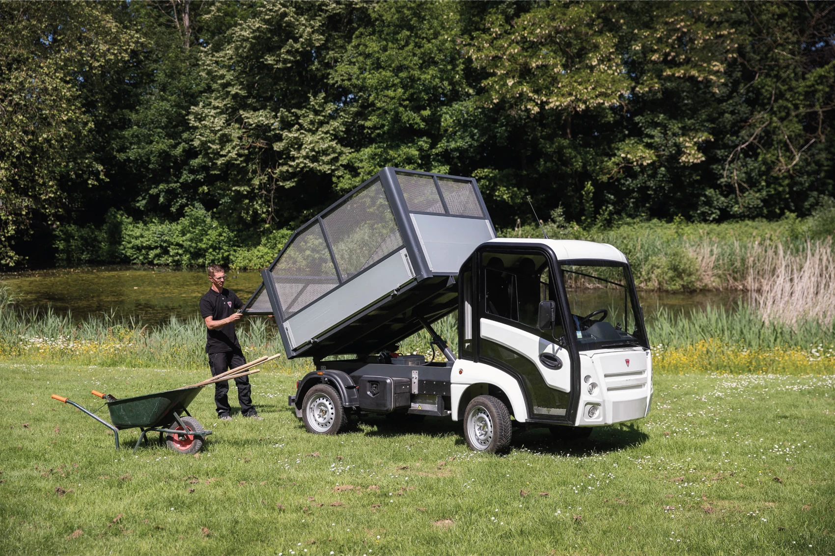 Narro tipper truck supporting grounds maintenance in a field